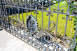 © Alexandr Blinov - Antique metal forged grate with decoration elements