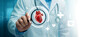 © ShepraRani - Professional cardiologist examining human heart anatomy with digital medical interface icons.