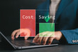 © Nirusmee - Businessman analyzing spending on laptop, representing cost savings, low-budget operations, waste reduction, and effective business management strategies.