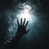 A hand reaching out from darkness with radiant light shining through water bubbles creating dramatic underwater scene