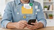 © Morgan - Man holding smartphone with secure folder icon and password lock symbol, mobile data protection and privacy security concept featuring verified checkmark and authentication icons