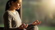 © FARDIN CREATIONS - Woman meditating indoors with hands in mudra position, wearing casual attire and serene expression.