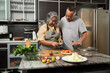 © Prot - Senior couple preparing healthy meal together in modern kitchen, symbolizing family bonding, wellness, and positive lifestyle in cozy indoor environment with vegetables, natural daylight