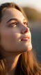 © Santri - Young Woman Looking Up Towards the Sun with Hope and Serenity.