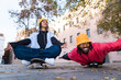 © Westend61 - Playful skateboarder having fun on the street in Barcelona