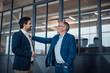 © Westend61 - Engineers communicating and supporting each other in an office setting
