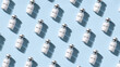 © Victoria - medical vials with peptide on light blue background. Pharmaceutical glass bottles arranged in rows. Scientific research and clinical trial concept. Healthcare and pharmacy supply item