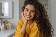 © Iryna - Young woman smiling and posing in bathroom vanity setting