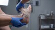 © Yuliya - Ankle sprain RICE protocol treatment application by urgent care medical assistant