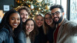 © Wendy - Diverse group of happy young business people or friends taking a selfie photo on smartphone during a christmas party in a modern office.