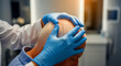 © MÜLLER DAVID MARKUS - Doctor in blue gloves examining the balding scalp of a senior male patient. Medical professional performing hair loss assessment in a clinic. Dermatology concept for hair restoration marketing.