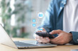© A Stockphoto - Cybersecurity protects Login , Businessman using mobile phone to log in securely with user interface screen data protection, privacy, authentication, and online security.