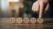 © alex - Close-up of a hand selecting a smiling face wooden block, representing top customer satisfaction and excellent service feedback