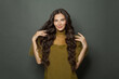 © millaf (Nemchinova) - Joyful woman hair. Beautiful model with long curly hairstyle posing