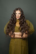 © millaf (Nemchinova) - Attractive long hair woman, classic hairs curly. Brunette model with wavy hair looking at camera