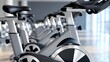 © Sunny_nsk - Rows of gym exercise bikes in modern fitness studio