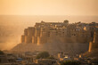 © Panoy - Realistic Jaisalmer Fort emerging from desert dust haze