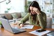 © PheelingsMedia - Worried teleworker filling out form or doint test