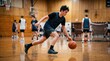 © Viktoriia - Teen boy playing basketball on indoor court. Young athlete dribbling ball during practice match. Hobby and sport training activity for healthy lifestyle and physical competition.