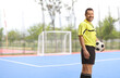 © Ljupco Smokovski - Football referee holding a ball