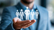 © Nataliya - Close-up of a businessman holding a virtual team leader and employee profile selection concept on a digital screen, leadership recruitment concept, team profile photography,