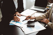 © Daenin - Business team analyzing financial data and market statistics, collaborating on project planning, discussing investment strategies, and reviewing growth reports in an office meeting