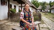 © aiin en - Smiling mature woman representing traditional heritage and authentic folk culture while sitting outdoors in a rustic village setting