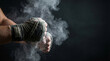 © Ratchanon - Boxer hand chalk dust strong athlete sports fitness preparation dark background determination power focus energy motivation