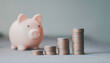 © Krittamet - Piggy bank, stacked coins representing financial savings, investment growth, wealth accumulation, budgeting, retirement planning, economic stability, passive income, money management.