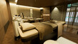 © ADDICTIVE STOCK - Modern spa treatment room with massage beds and warm light