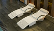 © ADDICTIVE STOCK - Modern spa lounge chairs by indoor pool in luxury resort
