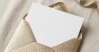 © Natalia - Gold Glitter Envelope with White Card on Textured Fabric for Wedding Invitations