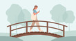© liam - Woman walking on bridge with phone in park, healthy lifestyle, nature, connection