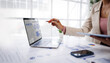© groviapoto - Businesswoman or accountant conducting an analysis of financial reports on a laptop, emphasizing the utilization of digital tools for data interpretation and informed decision-making.
