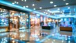 © morepiixel - Blurred image of a modern shopping mall interior with bright lights, reflective floors, and storefronts creating a vibrant, bustling atmosphere.