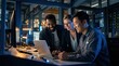© 5 Grace Media - Diverse Team of Engineers Collaborating on Laptop in Dark Server Room.