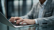 © ASDF - Professional man types on laptop at sleek desk