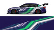 © Lailatul - Sleek blue and green racecar with dynamic stripes captured from a side profile.