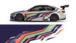 © Lailatul - Colorful Wrapped Racecar with Dynamic Abstract Livery and Bold Stripes.