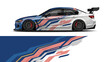© Lailatul - High‑speed blue and red graphic race car with aerodynamic livery and rear spoiler on track.