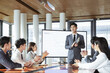 © DaoYenThu - Business Team Applauding Presenter in Office Meeting