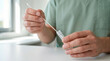 © AucArtStudio - Test tube virus swab sample lab healthcare clinical hands medical worker holding swab above test tube during. Disease infection pandemic epidemic. scientist laboratory research, diagnostic sample