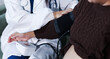 © Aungkana - cropped shot of doctor examining pregnant woman during medical consultation