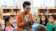 © Aurora Aesthetics - african american female preschool teacher young children kids daycare classroom diverse playful mentor warm preschool teacher sitting with circle of toddlers playing with colorful blocks for early