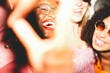 © DisobeyArt - Crazy women friends having fun at night time listening music outdoor and taking photos together - Party, nightlife and people lifestyle concept - UGC flash content - Main focus on african girl face