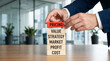 © Vactzone - Businessman in elegant suit stacking conceptual pricing blocks symbolizing comprehensive market strategy and financial profit generation