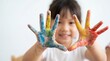 © Aurora Aesthetics - child painted hands colorful creativity art play preschool education messy fun childhood expression with smiling girl holding bright palms forward for learning craft therapy imagination and family