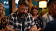 © Maksym - A grief counselor places a hand on a man's forearm as others in the circle bow their heads, rain on tall windows behind the group, warm lamplight steady in the room, perfect for grief support groups