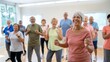 © swillklitch - Group of happy senior people dancing and doing light exercise together in a bright community center