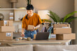 © ivanko80 - Woman packing online orders at home office for small e-commerce business